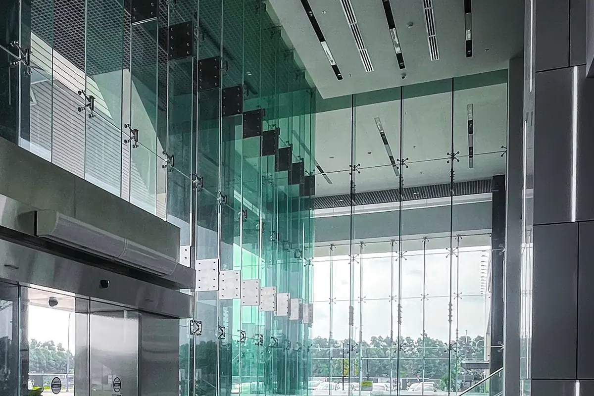 A corporate building lobby with glass walls