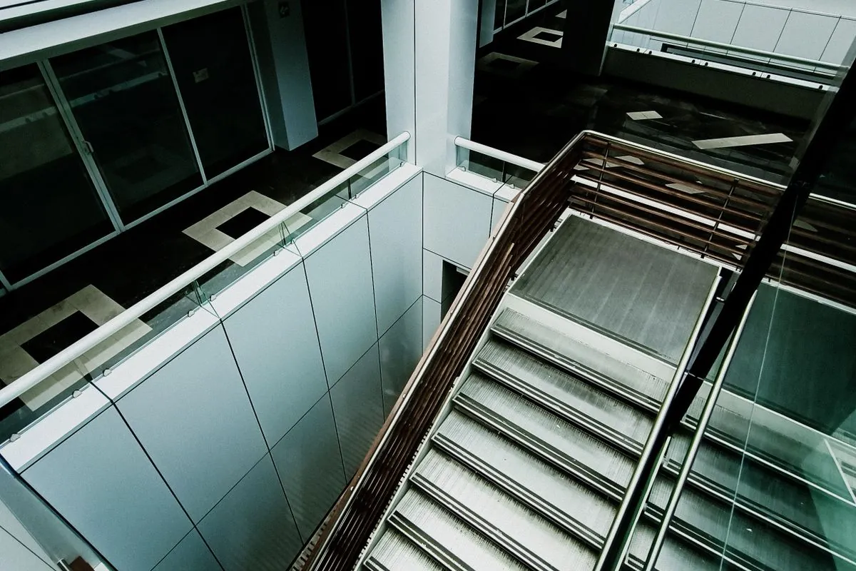 An atrium staircase in a modern office building