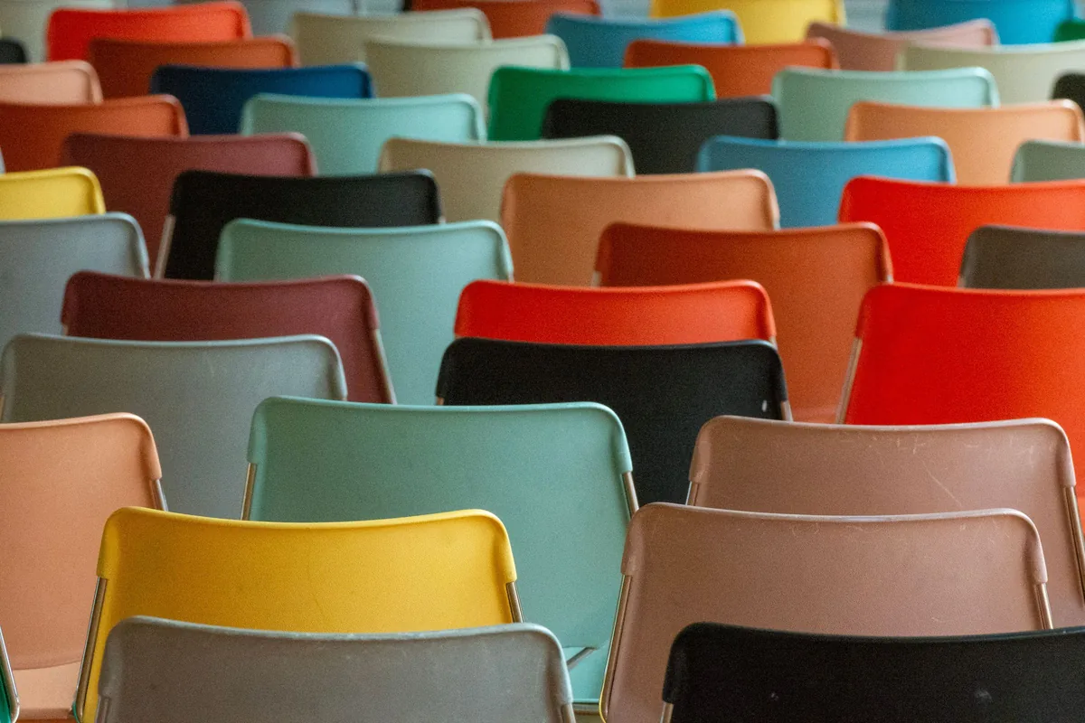 Rows of empty chairs in many colours