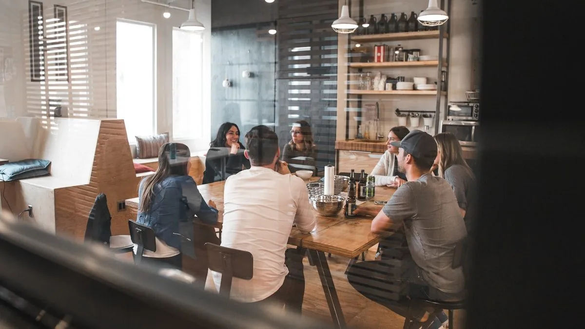 A small group of people meeting around a table